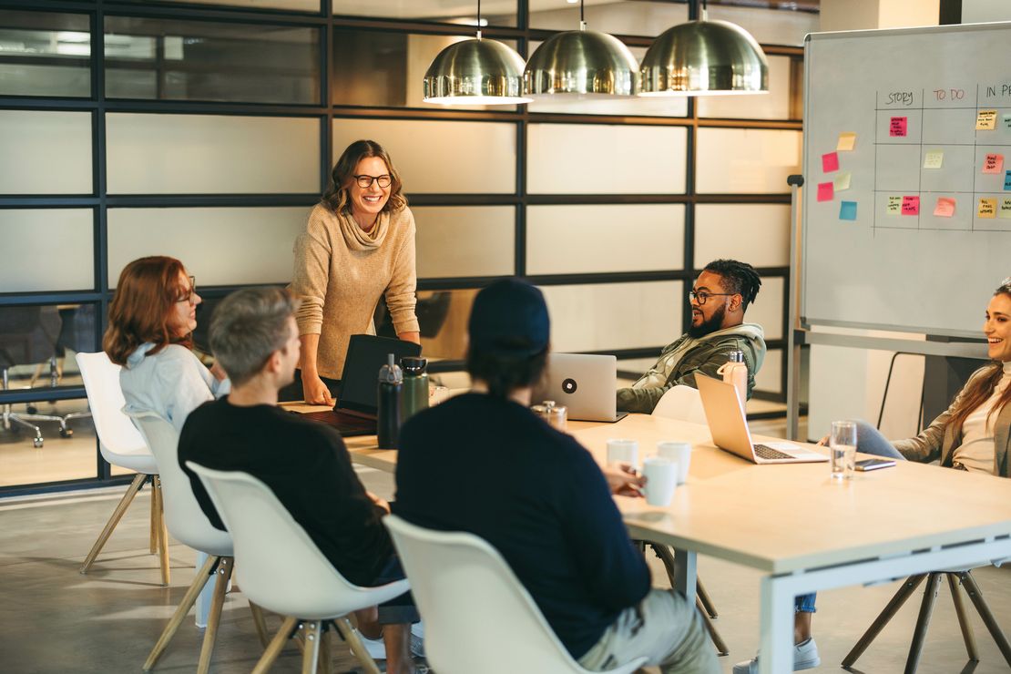 Creative business team: Boardroom brainstorming with a scrum master