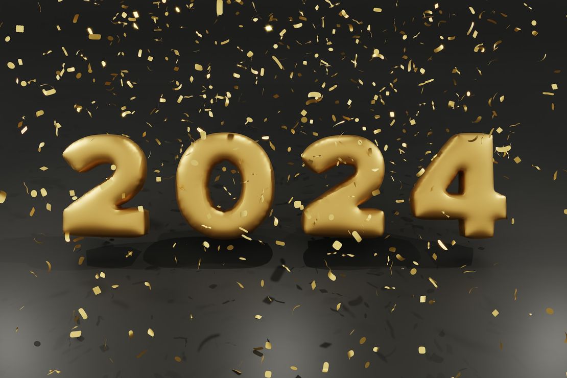Große goldene Zahlen 2024 umgeben von goldenem Konfetti